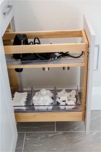 CE-Bath-Gallery11 A bathroom with a drawer full of towels and toiletries.