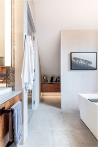 CE-Bath-Gallery8 A modern bathroom with a bathtub and sink.