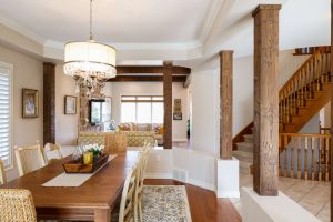 View this gallery image A dining room with a wooden table and chairs.