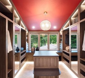 CE-Custom-Gallery2 A walk in closet with custom cabinets and a red ceiling.