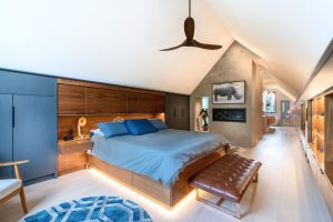 CE-Custom-Gallery5 A bedroom with a bed and custom cabinets.