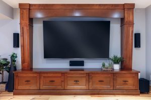 CE-Custom-Gallery7 A custom wooden cabinet with a flat-screen television.