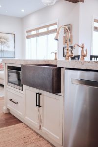 CE-Kitchen-Gallery10 A kitchen with a copper sink and stainless steel appliances.