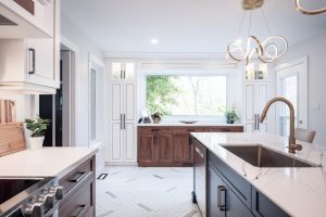 CE-Kitchen-Gallery12 A kitchen with white cabinets and marble counter tops.