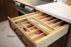 CE-Kitchen-Gallery13 A kitchen drawer is filled with utensils and utensils.