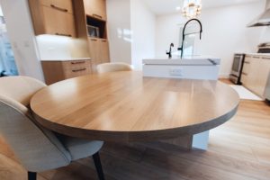 CE-Kitchen-Gallery15 A round dinning table in with wodden cabinets behind in the kitchen