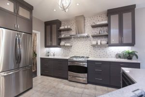 CE-Kitchen-Gallery37 A kitchen with stainless steel appliances and grey cabinets.