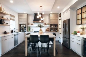 CE-Kitchen-Gallery39 A white kitchen with a center island and white cabinets.