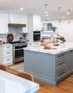 CE-Kitchen-Gallery43 A kitchen with white cabinets and marble counter tops.