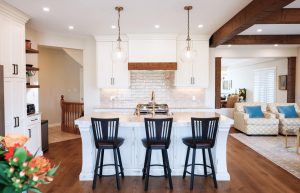 CE-Kitchen-Gallery9 A kitchen with white cabinets and black stools.